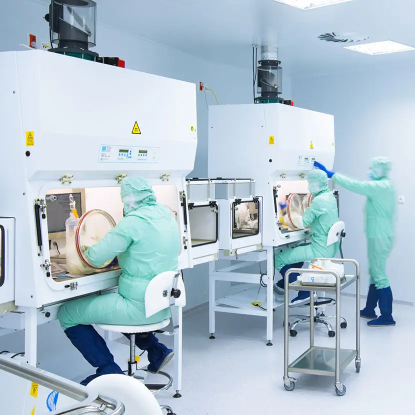 Compounding pharmacy cleanroom with isolator cabinets for sterile drug preparation